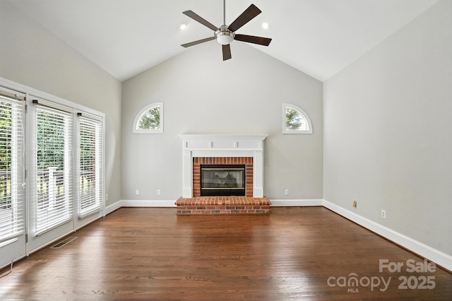 104 Fairwind Ct, Fort Mill, SC 29708 - unfurnished living room with ceiling fan, healthy amount of natural light, a fireplace, wood finished floors, and high vaulted ceiling