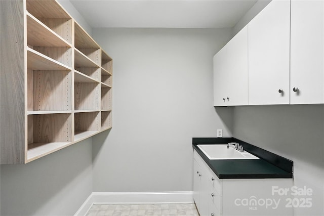 104 Fairwind Ct, Fort Mill, SC 29708 - laundry room with a sink and baseboards