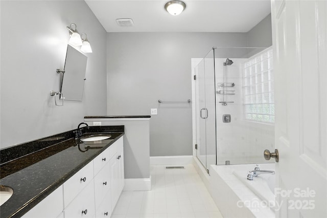 104 Fairwind Ct, Fort Mill, SC 29708 - full bath with double vanity, a stall shower, a garden tub, and tile patterned floors
