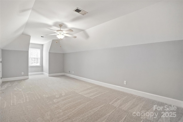104 Fairwind Ct, Fort Mill, SC 29708 - additional living space with light colored carpet, lofted ceiling, and ceiling fan