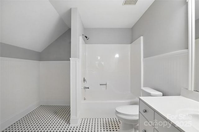 104 Fairwind Ct, Fort Mill, SC 29708 - full bath featuring vanity, a wainscoted wall, tub / shower combination, tile patterned floors, and lofted ceiling