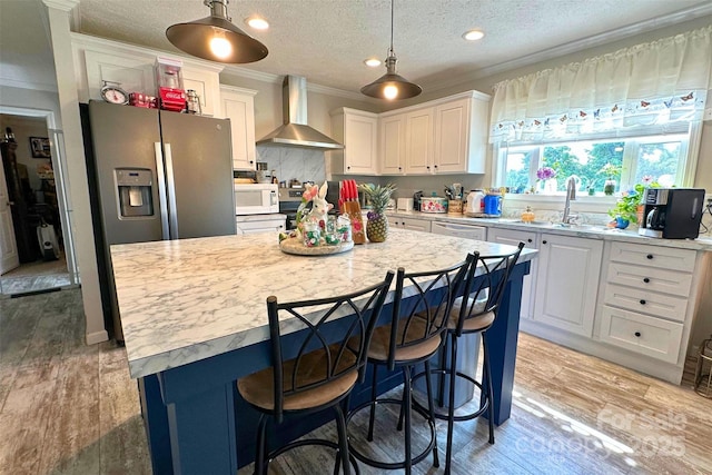 2449 Leonhardt Rd, Cherryville, NC 28021 - kitchen with wall chimney range hood, white appliances, white cabinets, ornamental molding, and a textured ceiling