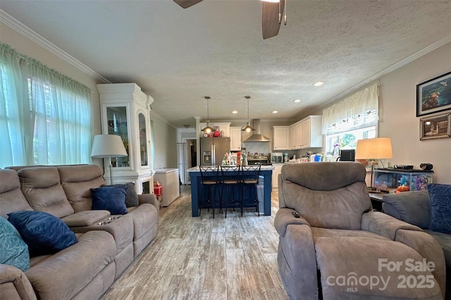 2449 Leonhardt Rd, Cherryville, NC 28021 - living room with healthy amount of natural light, light wood-style flooring, a ceiling fan, ornamental molding, and recessed lighting