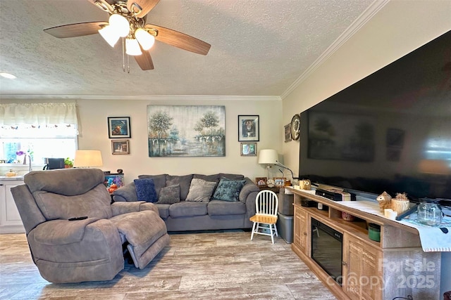 2449 Leonhardt Rd, Cherryville, NC 28021 - living room featuring a textured ceiling, crown molding, wood finished floors, and a ceiling fan