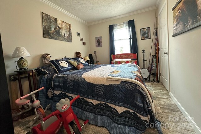 2449 Leonhardt Rd, Cherryville, NC 28021 - bedroom with wood finished floors, a textured ceiling, crown molding, and baseboards