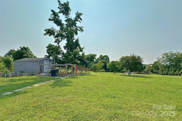 2449 Leonhardt Rd, Cherryville, NC 28021 - view of green lawn with an outdoor structure