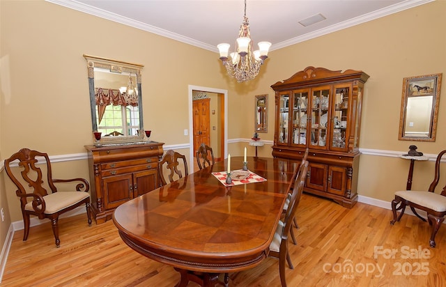 1250 Mountain Creek Rd, Rutherfordton, NC 28139 - dining area with a chandelier, light wood-style floors, ornamental molding, and baseboards