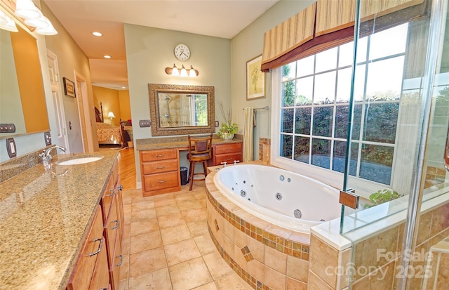 1250 Mountain Creek Rd, Rutherfordton, NC 28139 - bathroom featuring vanity, a jetted tub, tile patterned flooring, and recessed lighting