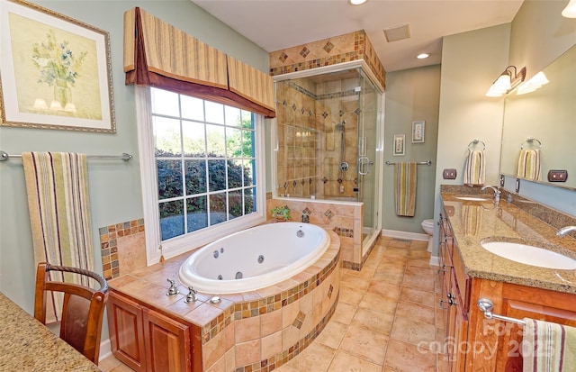 1250 Mountain Creek Rd, Rutherfordton, NC 28139 - full bathroom with a tub with jets, a shower stall, double vanity, toilet, and recessed lighting