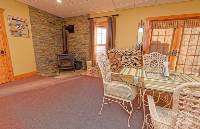 1250 Mountain Creek Rd, Rutherfordton, NC 28139 - dining area featuring a wood stove, carpet flooring, and a drop ceiling