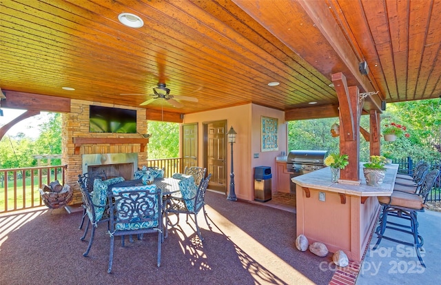 1250 Mountain Creek Rd, Rutherfordton, NC 28139 - view of patio with an outdoor stone fireplace, grilling area, an outdoor bar, and outdoor dining area