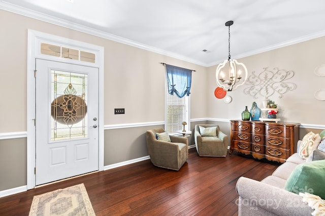 622 Lorain Ave NW, Concord, NC 28027 - entrance foyer featuring a chandelier, hardwood / wood-style flooring, and crown molding