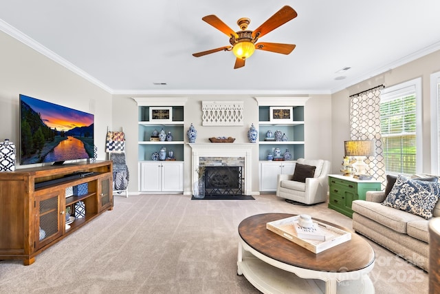 622 Lorain Ave NW, Concord, NC 28027 - living area featuring ornamental molding, ceiling fan, a fireplace, light colored carpet, and built in shelves