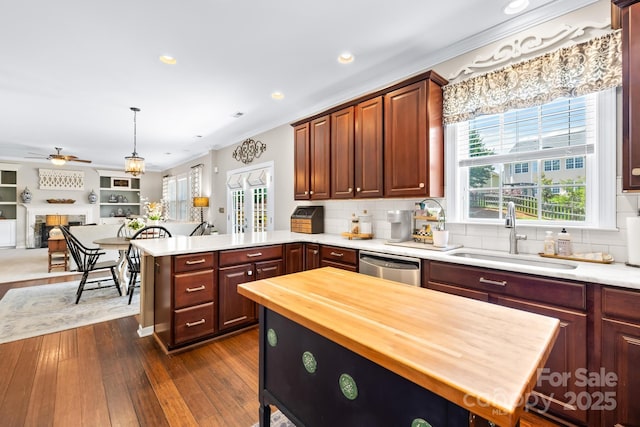 622 Lorain Ave NW, Concord, NC 28027 - kitchen featuring wooden counters, stainless steel dishwasher, a peninsula, open floor plan, and a ceiling fan