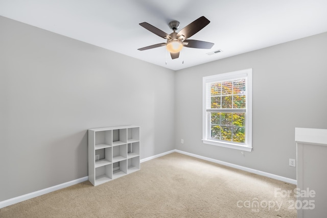 622 Lorain Ave NW, Concord, NC 28027 - carpeted empty room with baseboards and ceiling fan
