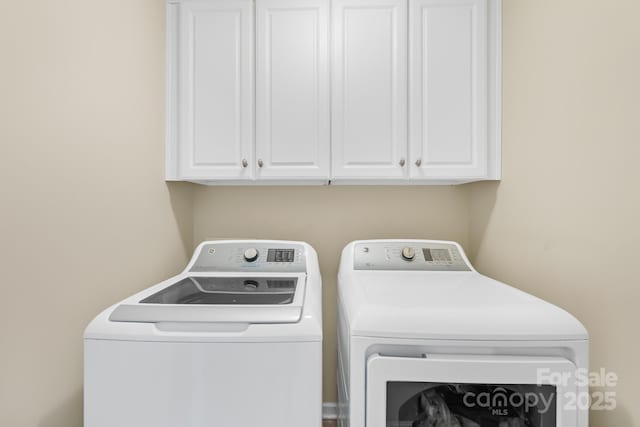 622 Lorain Ave NW, Concord, NC 28027 - laundry area featuring washer and dryer and cabinet space