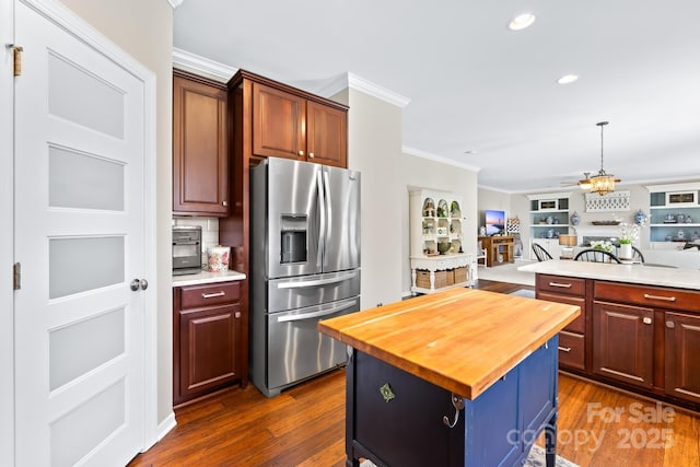 622 Lorain Ave NW, Concord, NC 28027 - kitchen with stainless steel fridge with ice dispenser, wooden counters, crown molding, dark wood finished floors, and open floor plan