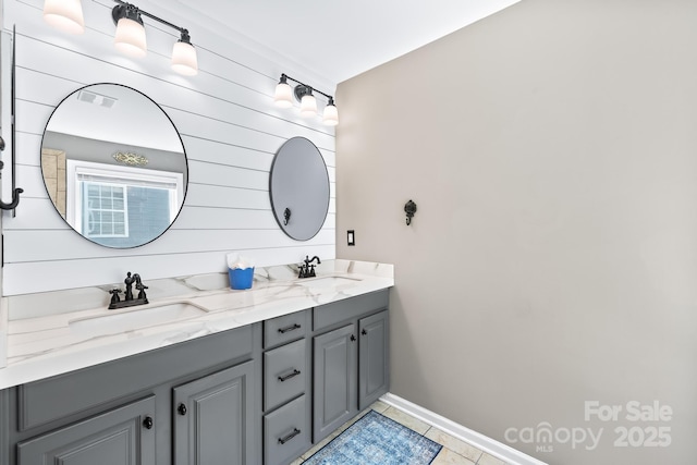 622 Lorain Ave NW, Concord, NC 28027 - bathroom featuring double vanity and tile patterned flooring