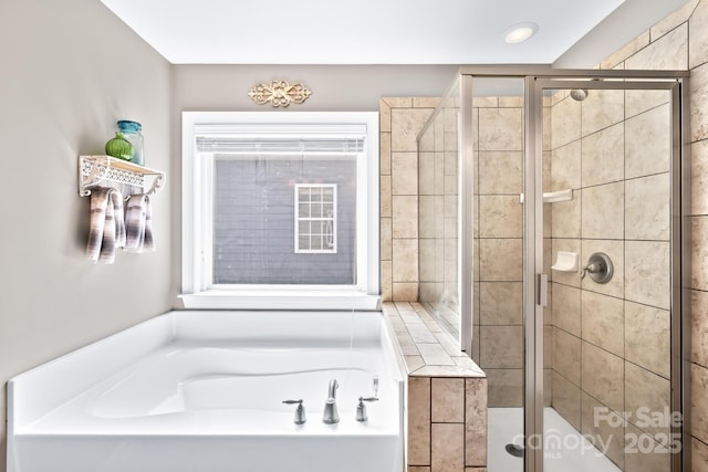 622 Lorain Ave NW, Concord, NC 28027 - full bath featuring a stall shower and a garden tub