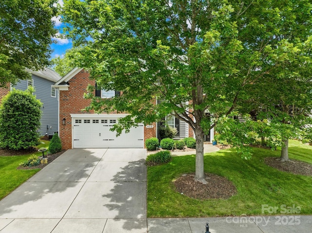 622 Lorain Ave NW, Concord, NC 28027 - obstructed view of property featuring driveway, a front lawn, an attached garage, and brick siding