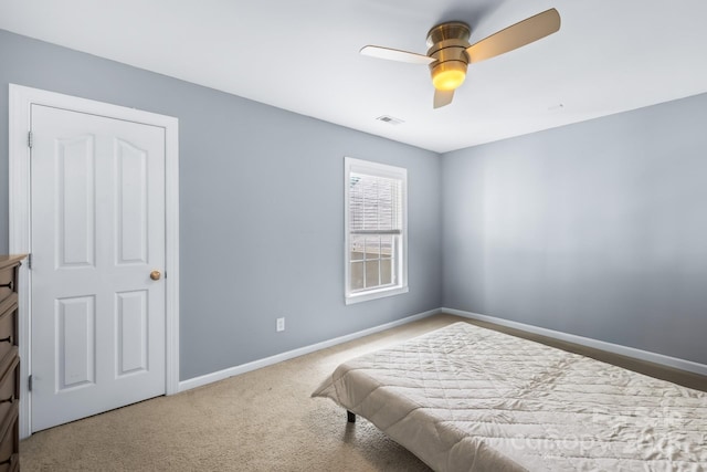 622 Lorain Ave NW, Concord, NC 28027 - carpeted bedroom with baseboards and ceiling fan
