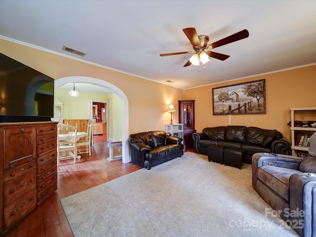 1614 Linwood Rd, Gaston, NC 28052 - living room with arched walkways, ceiling fan, wood finished floors, and ornamental molding