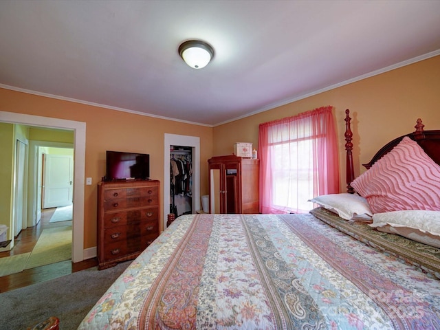1614 Linwood Rd, Gaston, NC 28052 - bedroom with ornamental molding, a walk in closet, a closet, and baseboards
