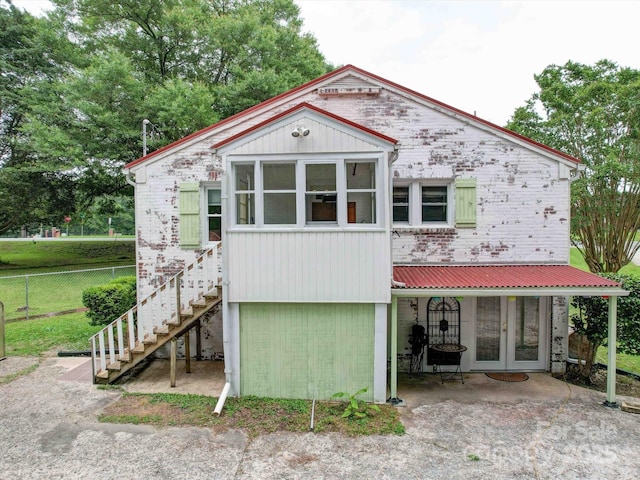 1614 Linwood Rd, Gaston, NC 28052 - view of front of home with stairs, brick siding, and metal roof