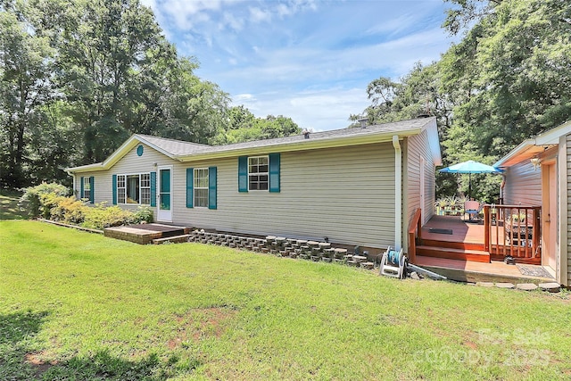 4104 Pebblebrook Cir SW, Concord, NC 28027 - rear view of property with a yard and a deck