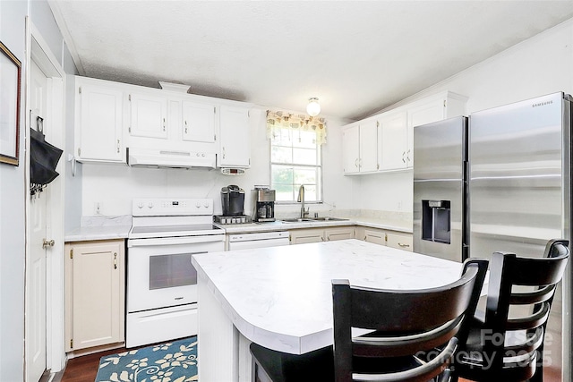 4104 Pebblebrook Cir SW, Concord, NC 28027 - kitchen with electric range, a sink, under cabinet range hood, and light countertops