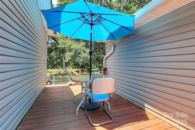 4104 Pebblebrook Cir SW, Concord, NC 28027 - wooden deck with outdoor dining space