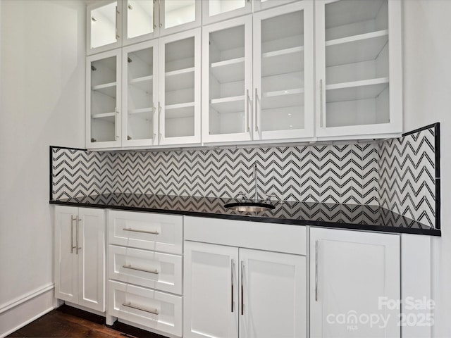 4300 Cameron Oaks Dr, Charlotte, NC 28211 - bar featuring decorative backsplash and dark wood finished floors