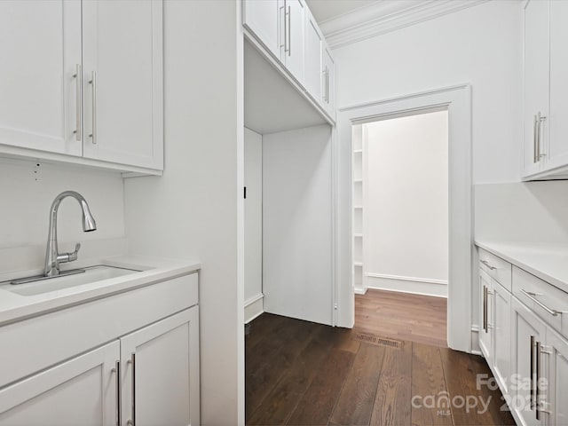 4300 Cameron Oaks Dr, Charlotte, NC 28211 - washroom featuring dark wood-style flooring and crown molding