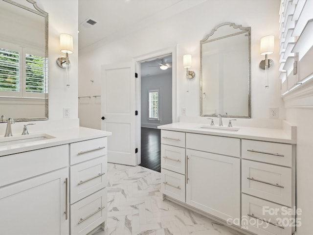 4300 Cameron Oaks Dr, Charlotte, NC 28211 - full bathroom with healthy amount of natural light, two vanities, and marble finish floors