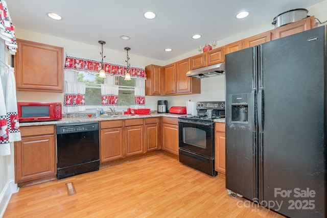 39 Selma Dr, Mooresville, NC 28115 - kitchen featuring black appliances, under cabinet range hood, a sink, light wood finished floors, and recessed lighting