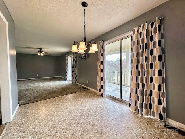 178 Cedar Valley Rd, Hudson, NC 28638 - unfurnished dining area with a textured ceiling, a ceiling fan, baseboards, and a chandelier