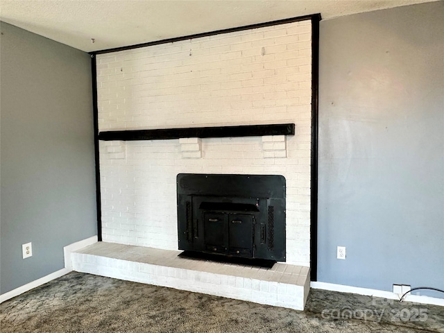 178 Cedar Valley Rd, Hudson, NC 28638 - detailed view of carpet flooring, baseboards, a fireplace, and a textured ceiling