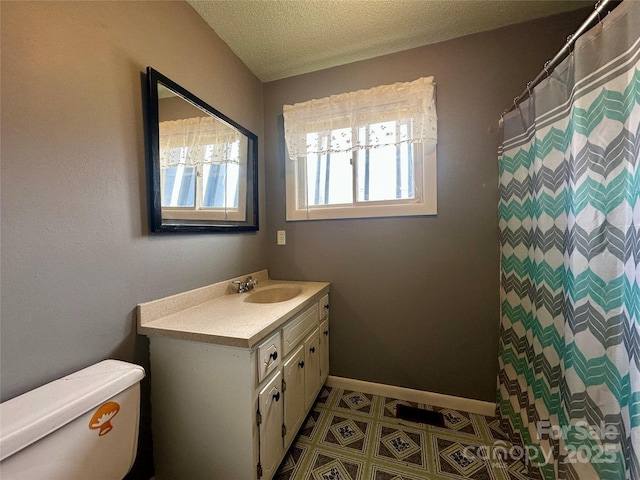 178 Cedar Valley Rd, Hudson, NC 28638 - full bath featuring toilet, vanity, baseboards, a textured ceiling, and tile patterned floors