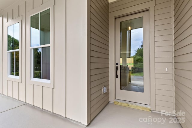 2413 Pruitt St, Charlotte, NC 28208 - view of exterior entry featuring board and batten siding