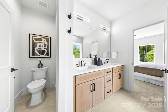 2413 Pruitt St, Charlotte, NC 28208 - full bathroom with double vanity, tile patterned floors, and connected bathroom