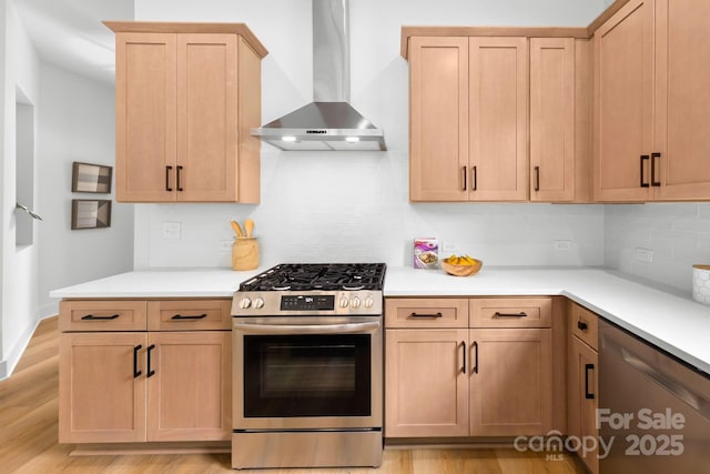2413 Pruitt St, Charlotte, NC 28208 - kitchen with appliances with stainless steel finishes, wall chimney range hood, decorative backsplash, and light countertops