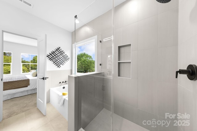 2413 Pruitt St, Charlotte, NC 28208 - full bathroom with a stall shower, plenty of natural light, ensuite bath, and a bath