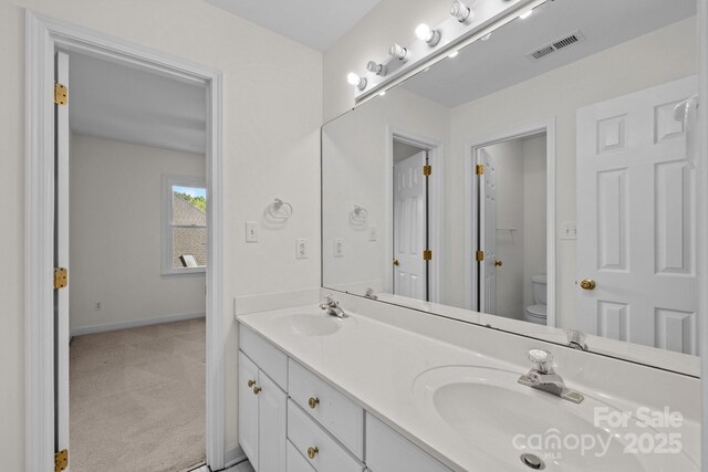 765 Portpatrick Pl, Fort Mill, SC 29708 - bathroom with double vanity, toilet, and baseboards