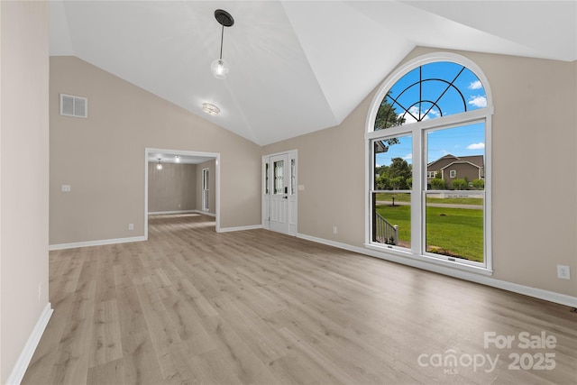 5916 Cashion Rd, Huntersville, NC 28078 - unfurnished living room with high vaulted ceiling, light wood-style flooring, and baseboards