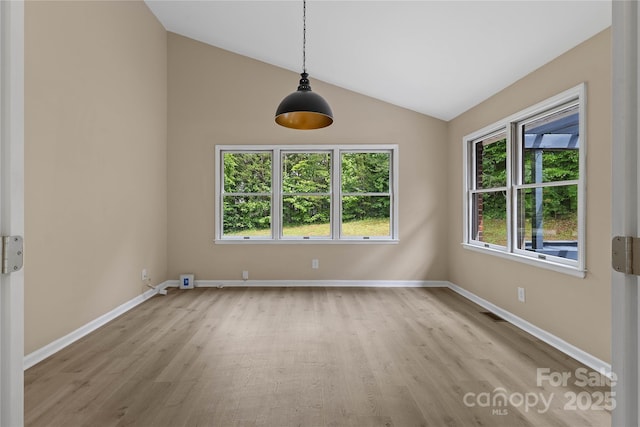 5916 Cashion Rd, Huntersville, NC 28078 - unfurnished dining area featuring wood finished floors, plenty of natural light, vaulted ceiling, and baseboards