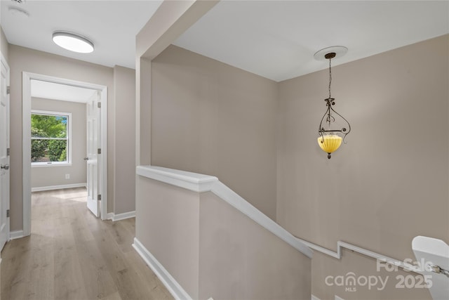 5916 Cashion Rd, Huntersville, NC 28078 - hall with an upstairs landing, light wood-type flooring, and baseboards