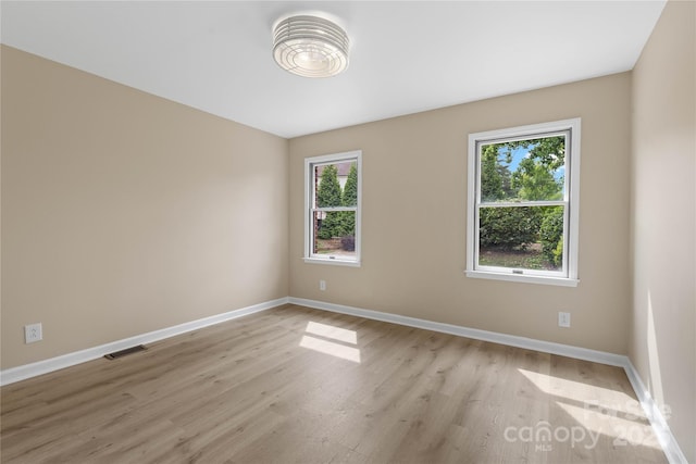 5916 Cashion Rd, Huntersville, NC 28078 - empty room with healthy amount of natural light, baseboards, and light wood finished floors