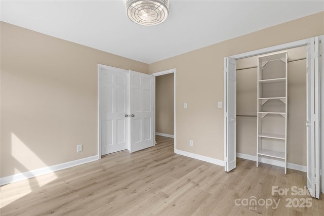 5916 Cashion Rd, Huntersville, NC 28078 - unfurnished bedroom with light wood-style flooring, baseboards, and a closet