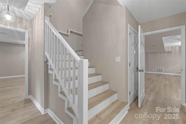 5916 Cashion Rd, Huntersville, NC 28078 - stairs with wood finished floors and baseboards