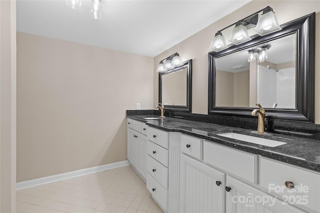 5916 Cashion Rd, Huntersville, NC 28078 - bathroom featuring double vanity, tile patterned flooring, and baseboards